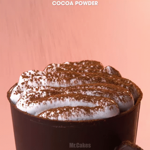 chocolate cake in a cup with powdered sugar on top