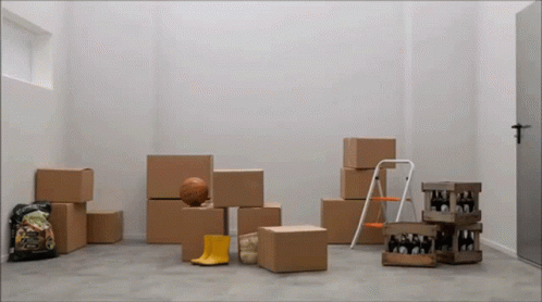 some boxes and other objects inside of a room