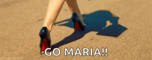 a woman in high heels walks across the floor