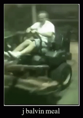 an image of a guy riding a mini scooter
