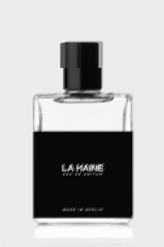 a bottle of cologne that has a black cap on top of it