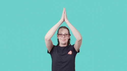 a person is doing yoga in front of a yellow background