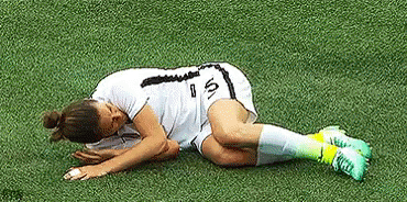 a man is lying on the ground wearing a fake soccer uniform