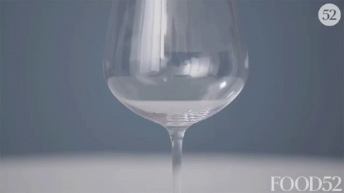 a glass filled with a liquid or soing