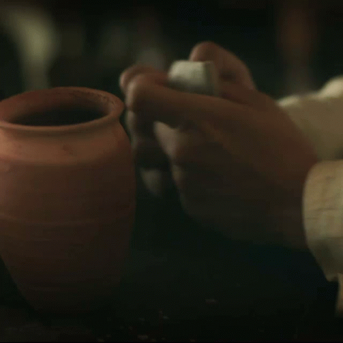 the pottery is being carved on the white plate