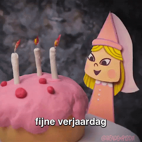 a cake with candles on it in the shape of a character
