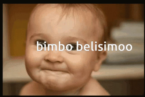 a baby looks at the camera with the word  belisiimoo behind it