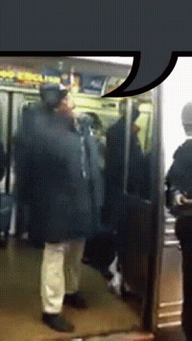 man in coat using cellphone on public transportation