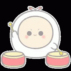 an egg with a bow sits on a plate