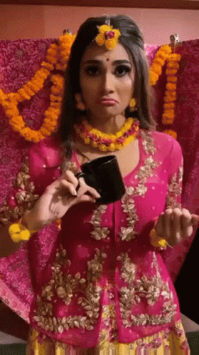 a young woman dressed in oriental attire and holding a smart phone