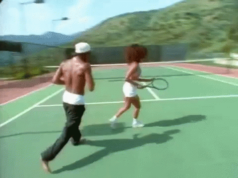some people playing tennis on a nice day