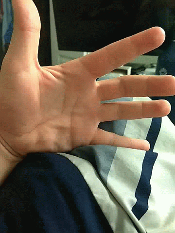 the thumb of someone is making a gesture with their fingers