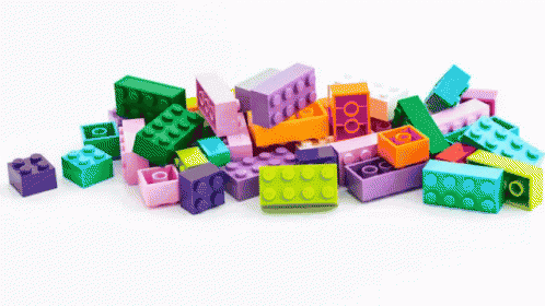 many colorful blocks and a lego sitting on top of each other