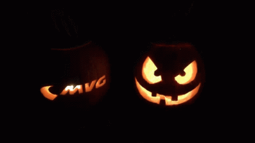 glowing jack o lantern pumpkins with dark background