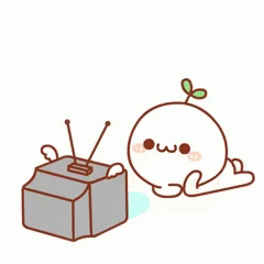 an image of a cute little tv sitting next to a toy