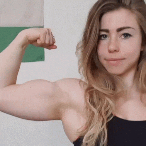 a woman with muscles in her arm showing