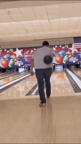 the person is on the bowling alley and it is moving