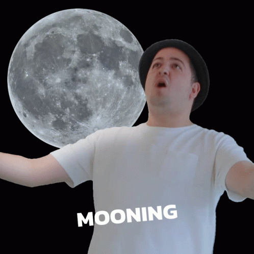 a man standing in front of the moon