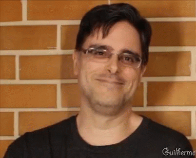 a man in glasses and a black shirt