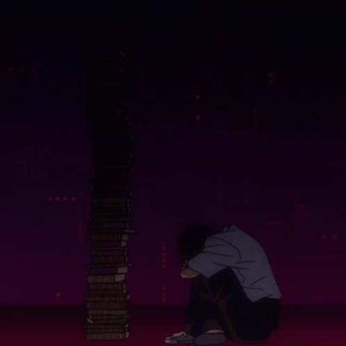 a man is squatting in the dark next to some stacked books