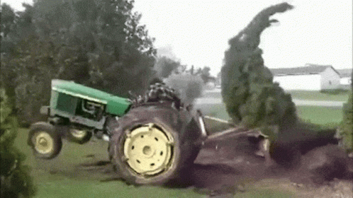 a tractor is falling off the ground