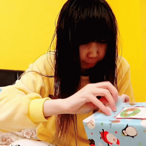 a girl has a present in her hands