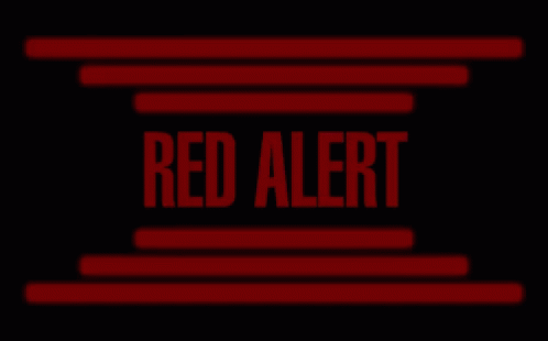 a red alert sign on a black background