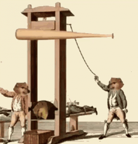 two men wearing hats holding a rope attached to a large machine