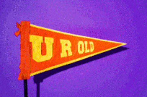 a blue u r old pennant on a pink background