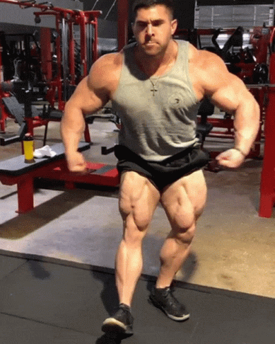 a bodybuilding man showing off his ripped upper and lower body