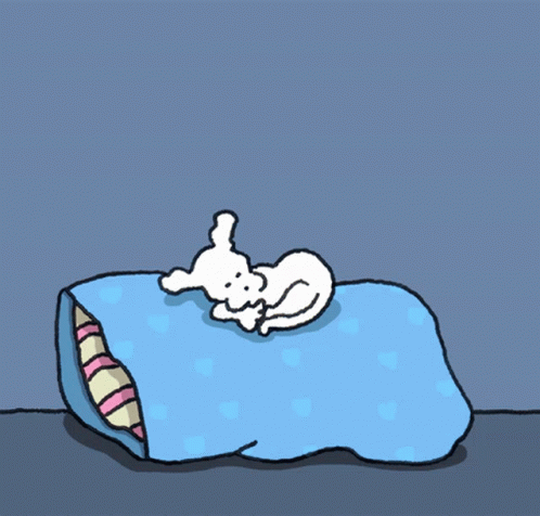 a cartoon of a dog sleeping on top of a blanket
