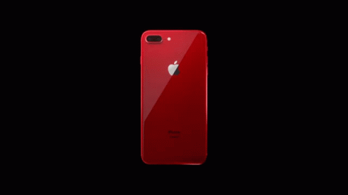 the back of an iphone with its screen illuminated against a dark background