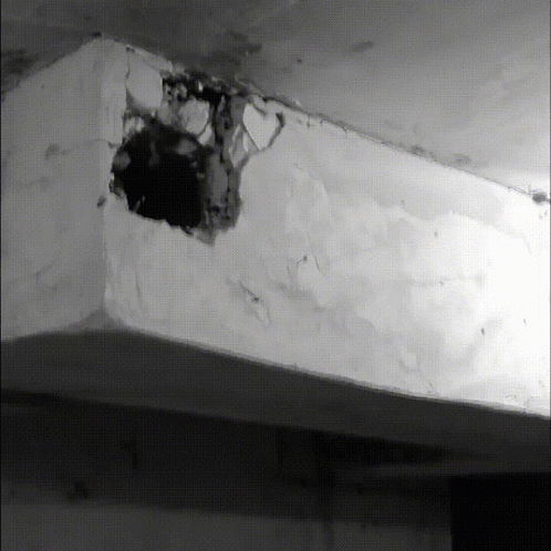a black and white po of an open hole in the ceiling