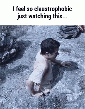 a child is playing on some rocks