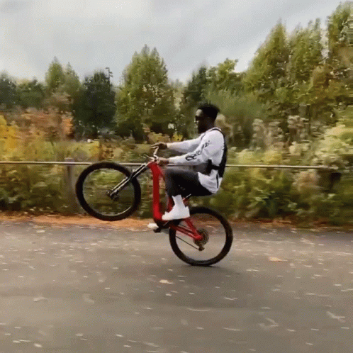 a man riding a bike while flying through the air