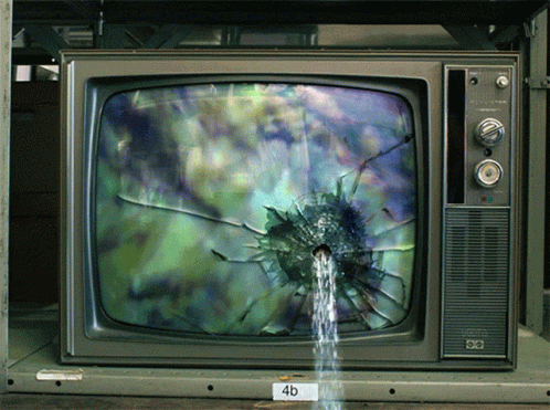 an old television with its screen and water spouting from it