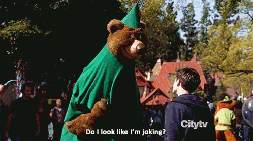 a person in a bear suit is dressed like a child and is holding a kite