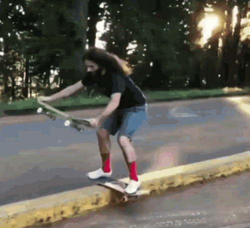 a person on a skateboard riding in the street