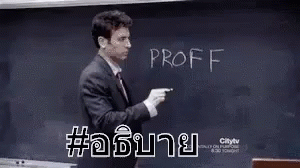 an asian language teacher writing on a chalkboard