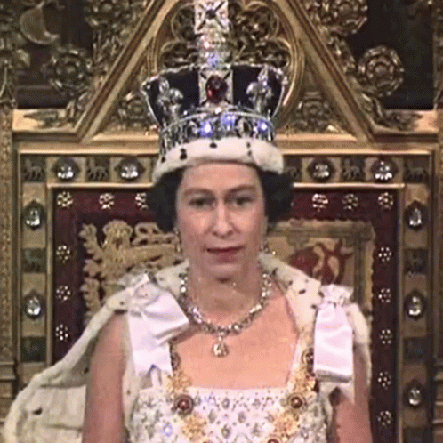 an old television showing the queen in coronation outfit
