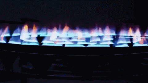 an open flame with lots of blue and white flames on it