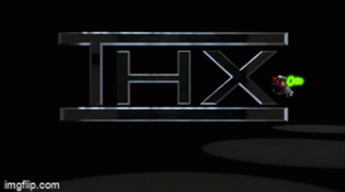 a logo of hx is illuminated against a dark background