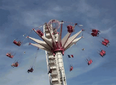 a po of the ferris wheel with people riding on it