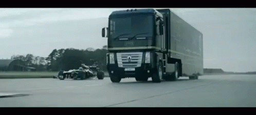 the truck is going to be stopped by the motorcycle on the road