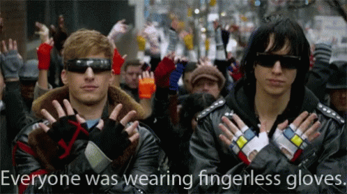 two characters dressed in blue and black make faces with hands with a message that reads, everyone was wearing fingerless gloves, and there is no