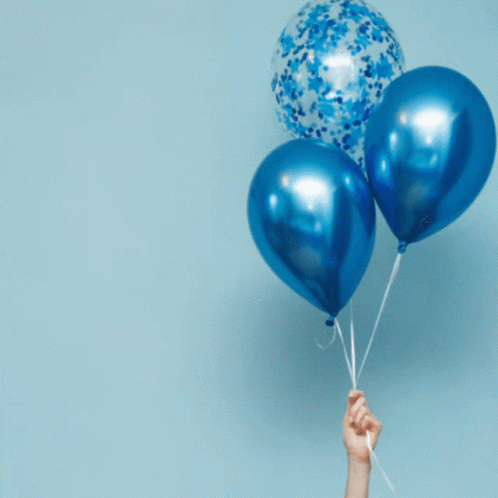 three balloons with a small blue hand holding them
