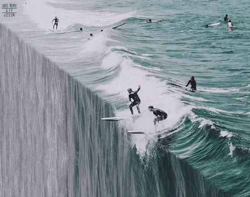 a group of people on surfboards ride on top of a waterfall