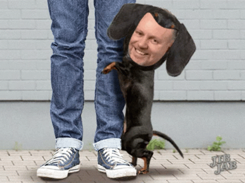 a man has painted a black dog's face on his shoes