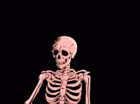 there is a human skeleton sitting on the floor