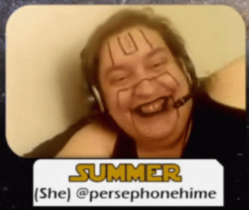 a person is smiling wearing headphones and an i smile sticker
